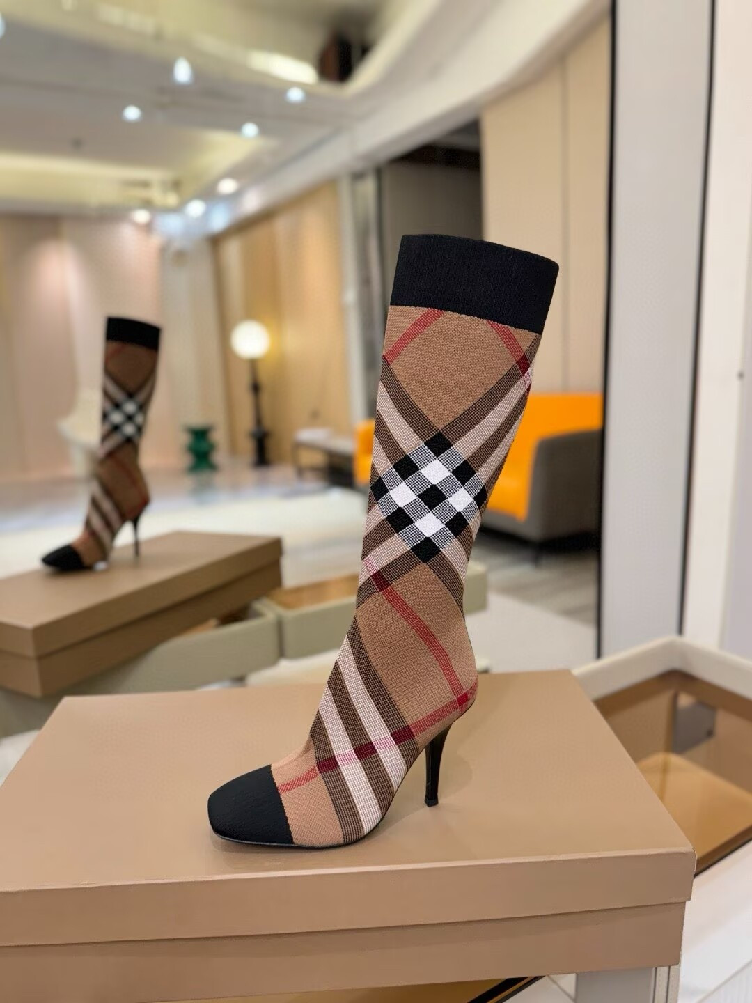 ua Bv*b*rry check high boots