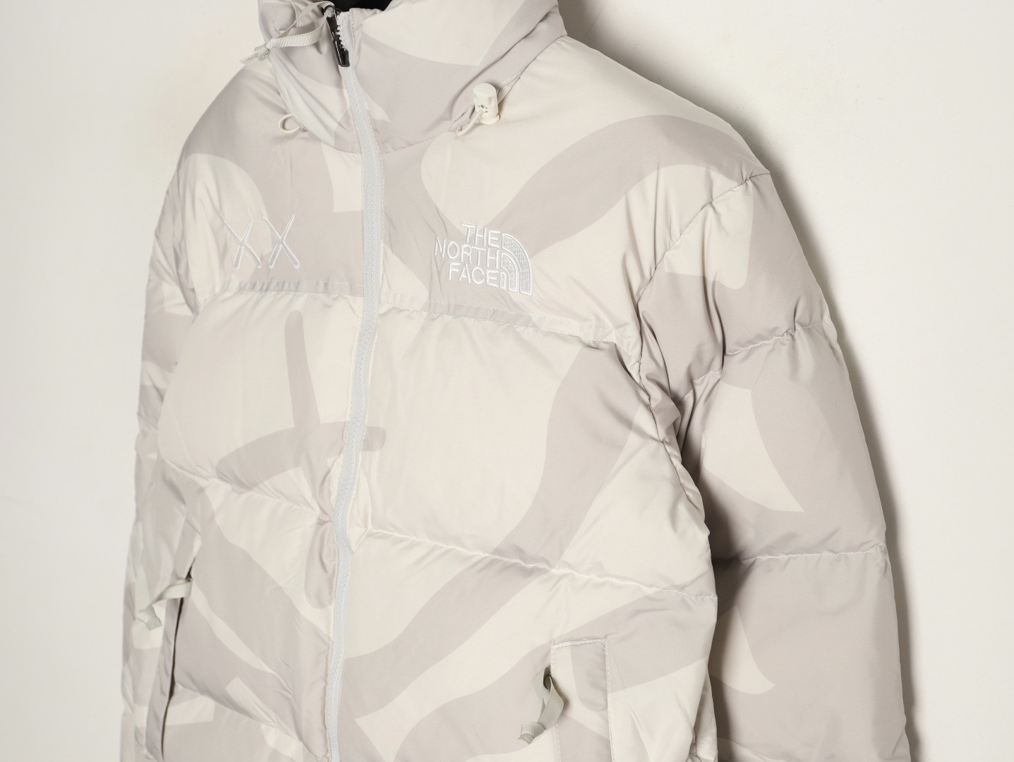 the n0r*h Fa*e x kaws short puffer jacket
