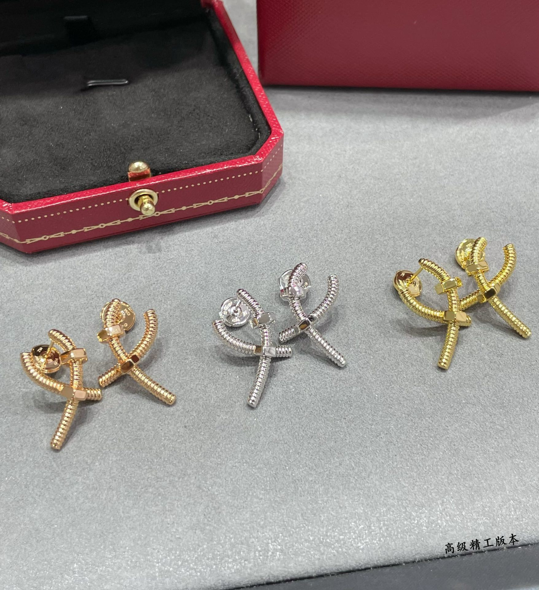 Ca*t1er Cross Screw Earrings