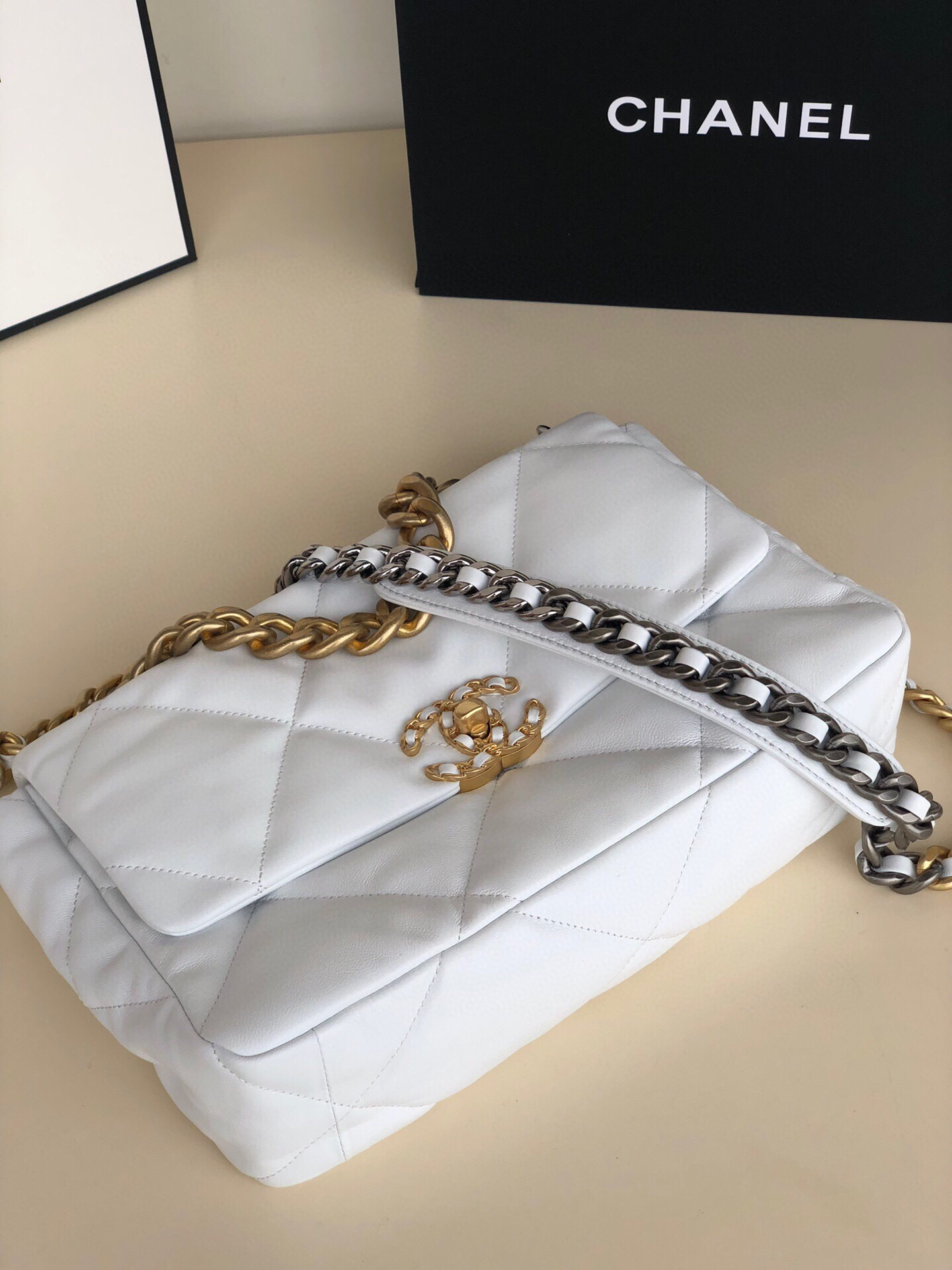 Ch**el 19 LARGE HANDBAG Shiny Leather, Gold-Tone, Silver-Tone & Ruthenium-Finish Metal White 7.8 × 11.7 × 3.9 in